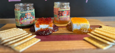 Strawberry Habanero Jelly and Cinnful Peach Habanero Jam poured over cream cheese and served with crackers