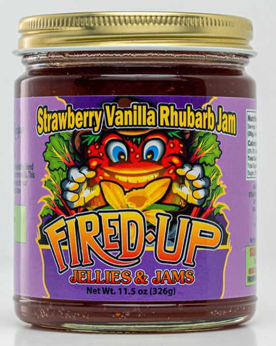 A 11.5 oz jar of Strawberry Vanilla Rhubarb Jam with a colorful label featuring an illustration of a Strawberry character named Patti.
