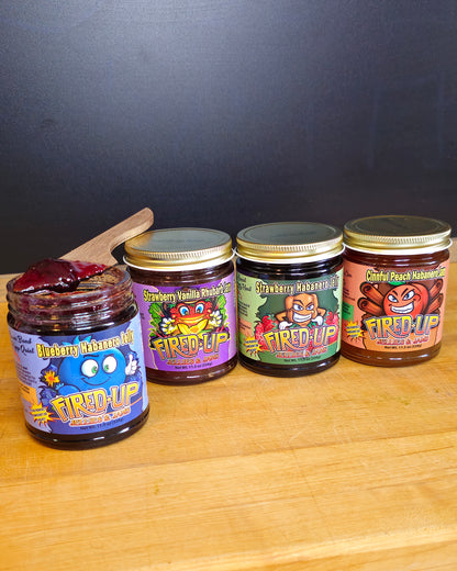 Blueberry Habanero Jelly with jelly on wooden knife resting on top of jar, Strawberry Vanilla Rhubarb Jam, Strawberry Habanero Jelly, Cinnful Peach Habanero Jam