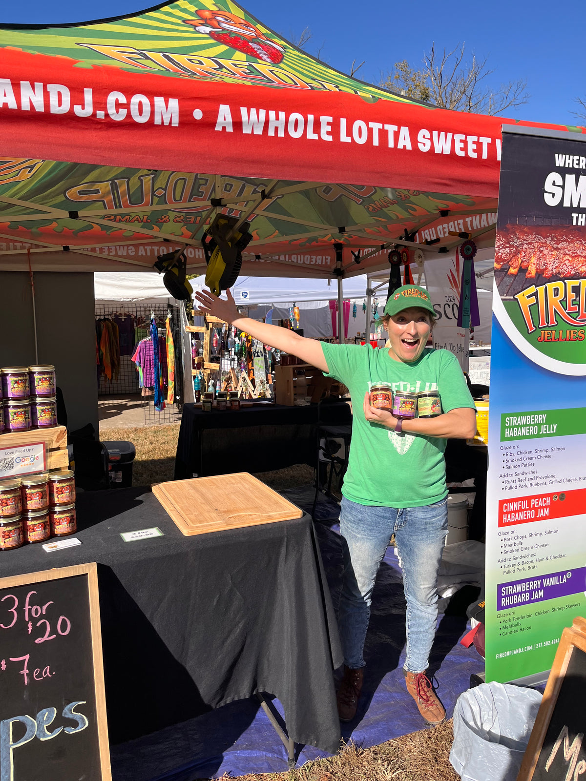 Krista setting up at an outdoor event, extra Fired Up vibes!