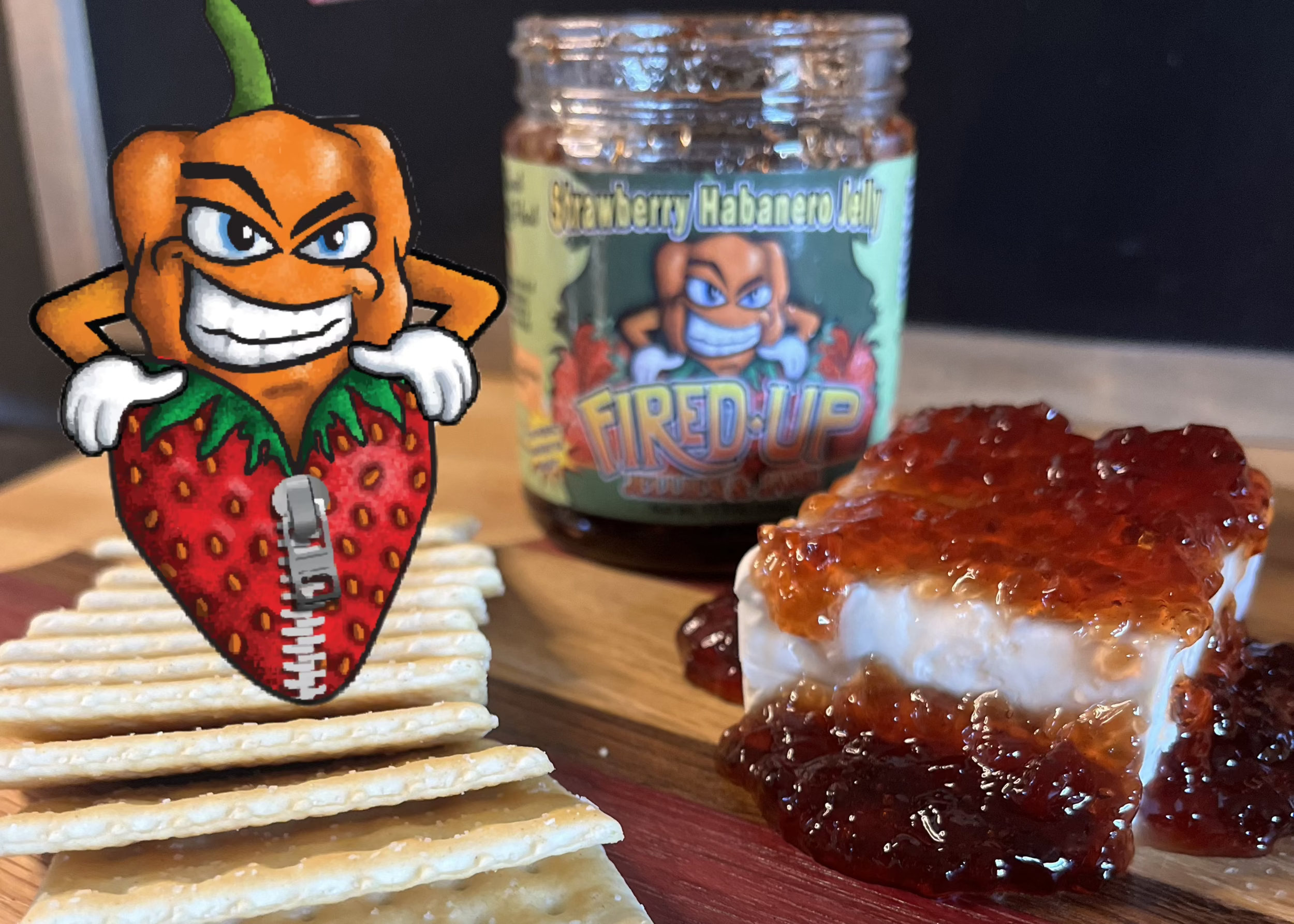 Strawberry habanero jelly with crackers and Pep on a Charcuterie Board